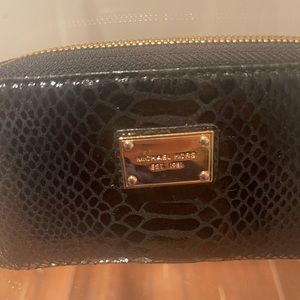 Michael Kors leather 6” wristlet wallet with strap. Excellent condition.